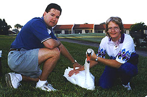 Dr. Geoffrey Gardner and Sheila Bolin with swan at Orange Lake Resort