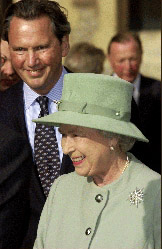 The Queen looks pleased as she receives the new State Bentley