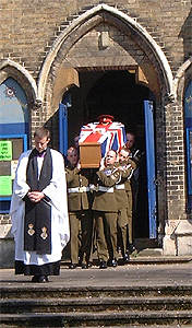 The coffin leaves the church